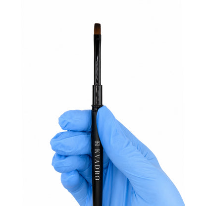 Close-up of the 6mm flat synthetic nylon bristles on the KVADRO Nail Brush