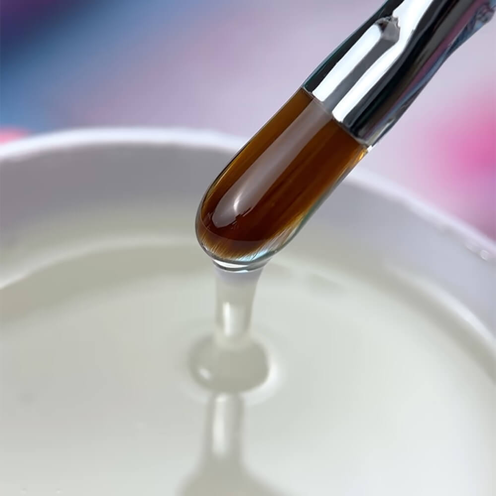 Applying LUNAmoon Fix Base with a flat gel brush