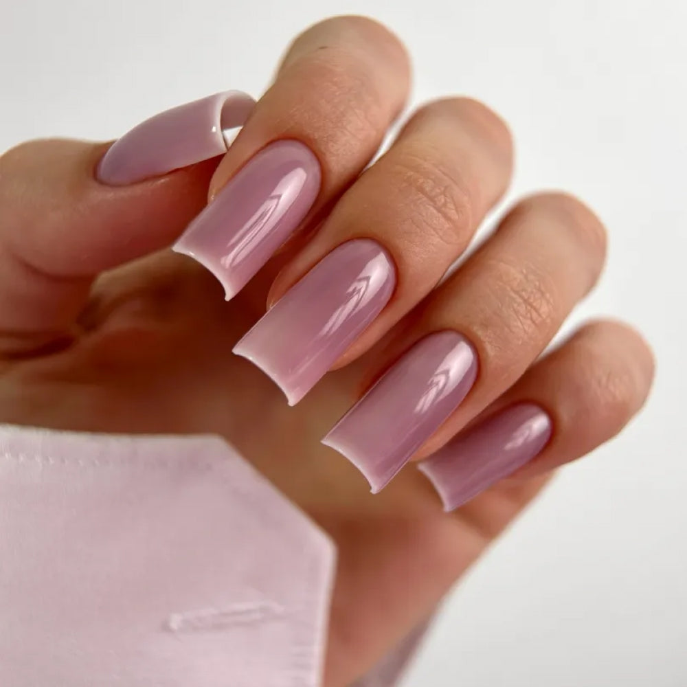 Glossy pink manicure finished with LUNAmoon Top Glass #17