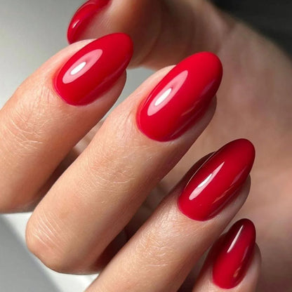 15ml — Luxio Classy Gel Polish — swatch on nail tip, cool-toned red finish