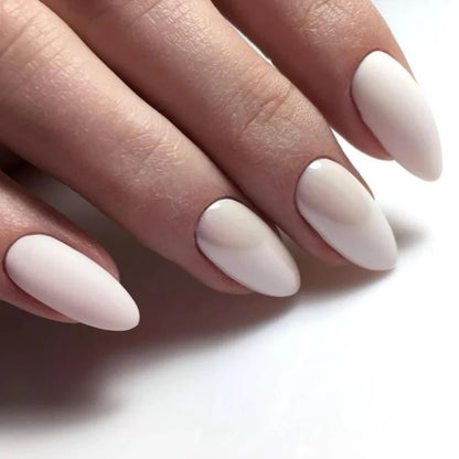 Luxio Ivory Gel Polish — swatch on nail tip, off-white finish