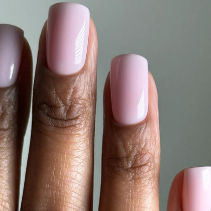 15ml — Luxio Petal Semi-Sheer Gel Polish — swatch on nail tip, delicate pale pink finish