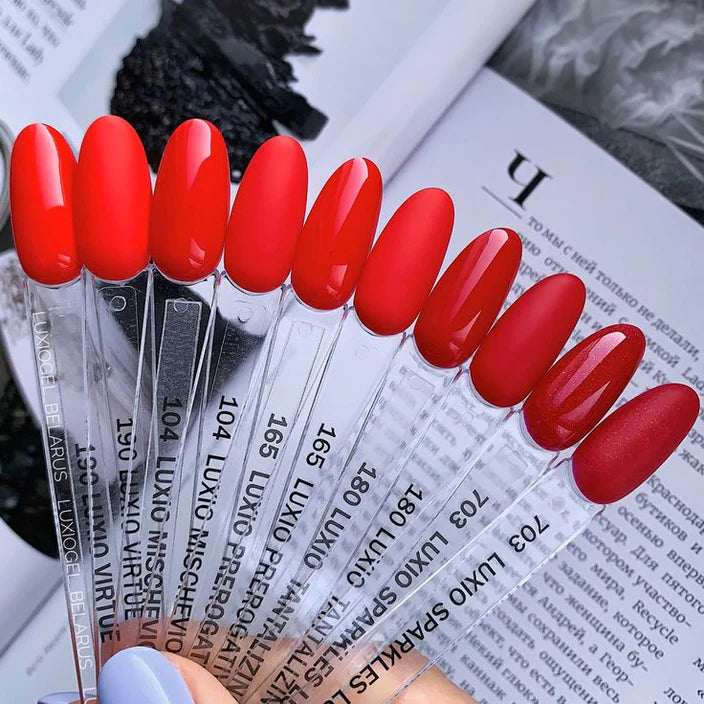 Luxio Virtue Gel Polish — swatch on nail tip, vivid bright red finish