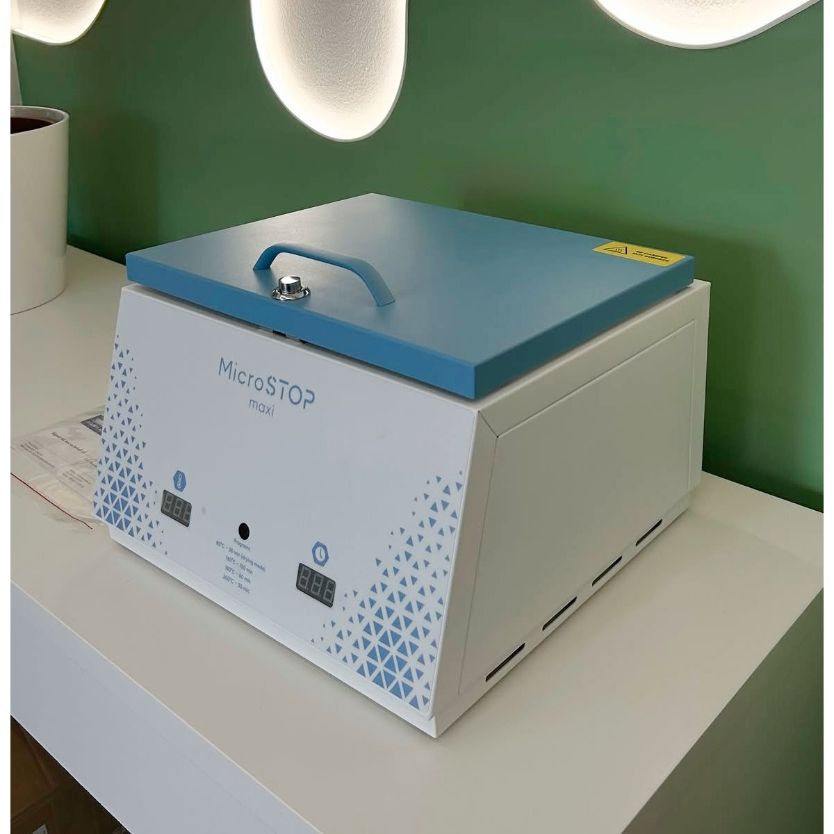 The MicroStop Maxi dry heat sterilizer holds 9 pouches or 6 tool sets for high-volume salons. 1-year warranty.