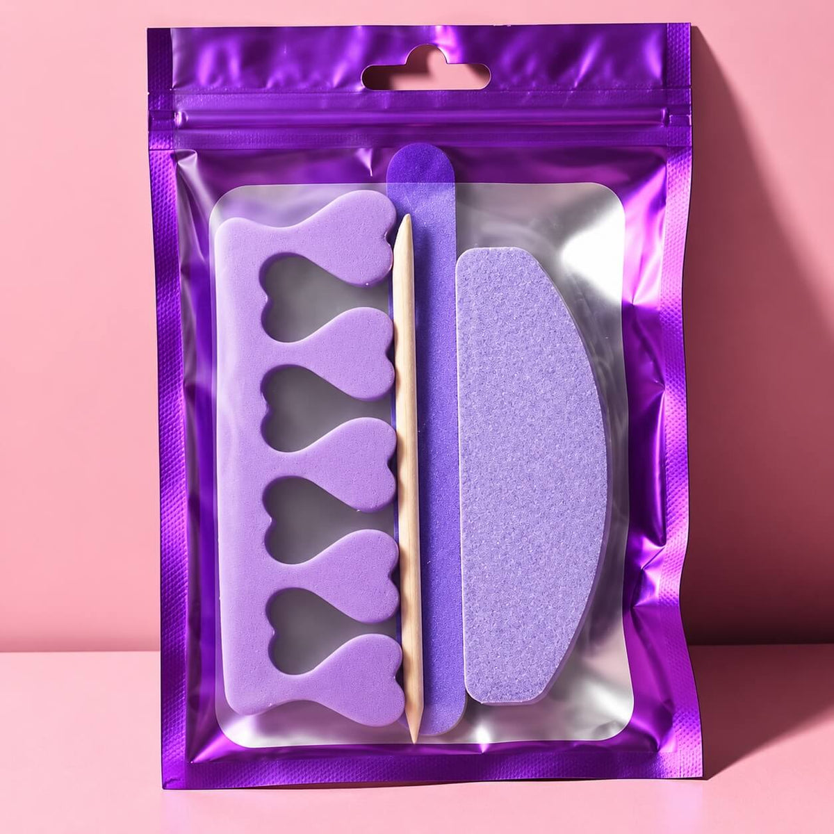Foam toe separator with heart-shaped slots