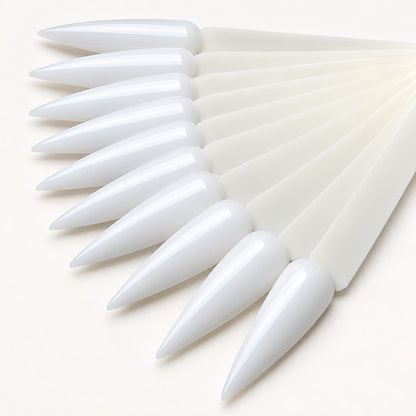 Long stiletto tips displaying a gel polish color palette