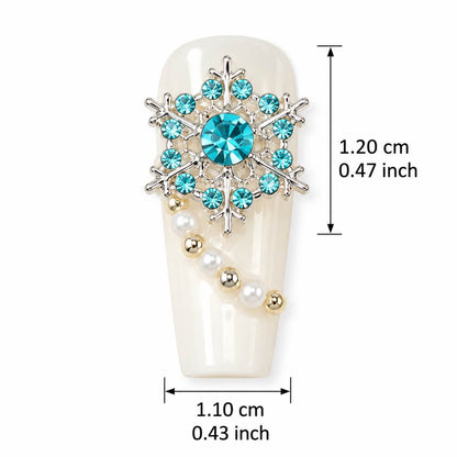Silver snowflake nail art charms with blue rhinestones and pearl accents, 30 pieces