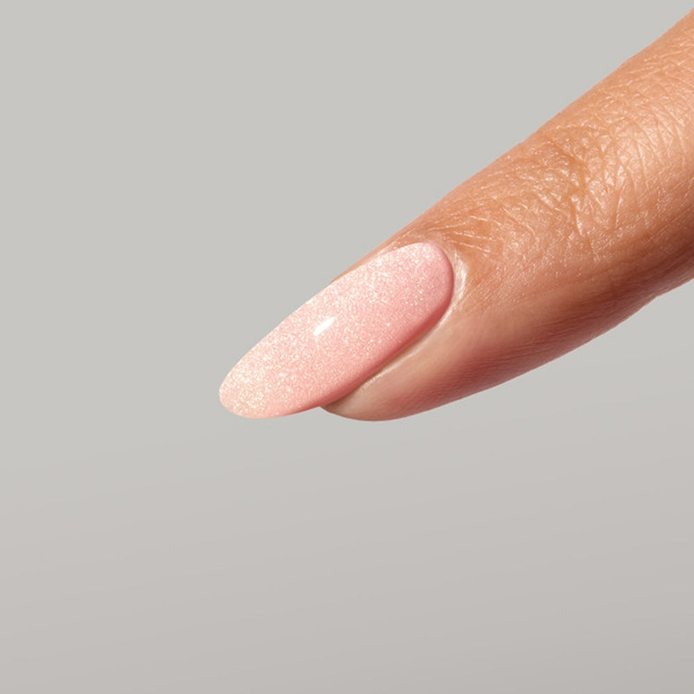Muted pink champagne cat-eye manicure using Glow Magnetic