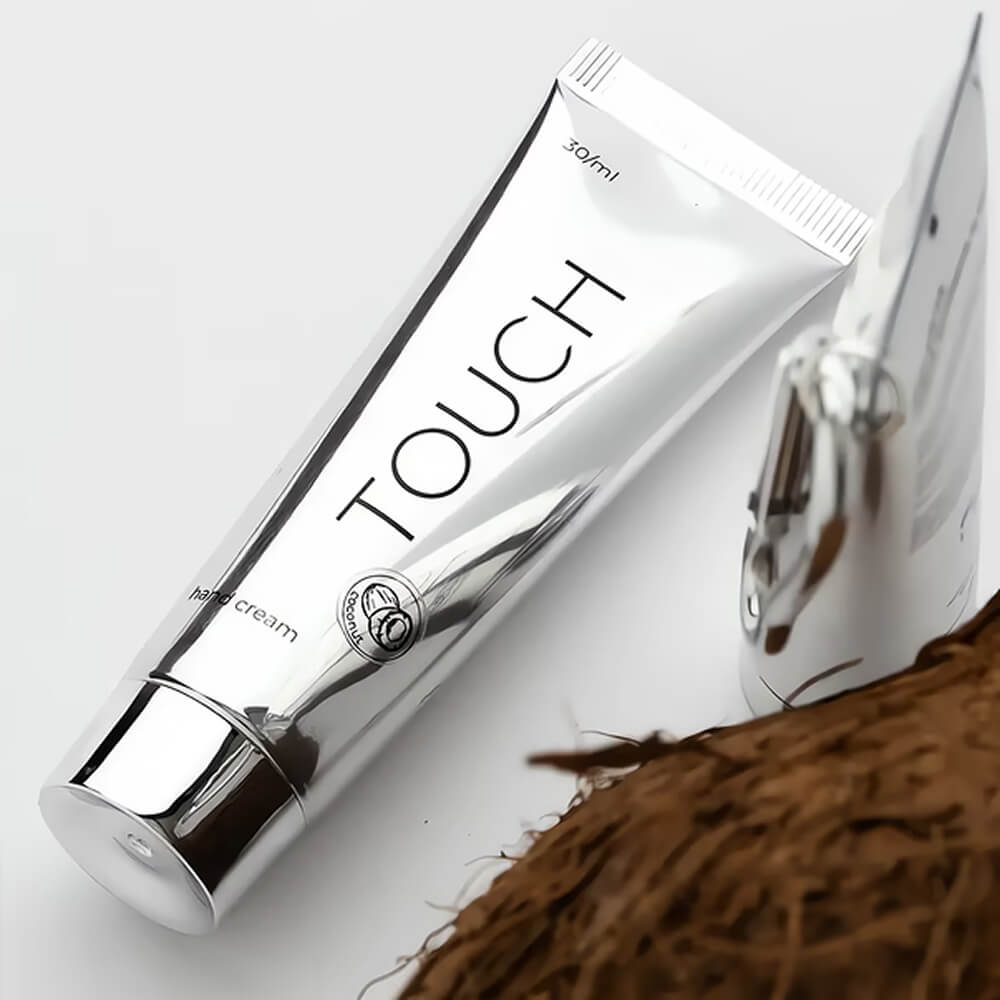 TOUCH Silver Line Hand Cream Coconut with Carabiner — clipped onto a bag