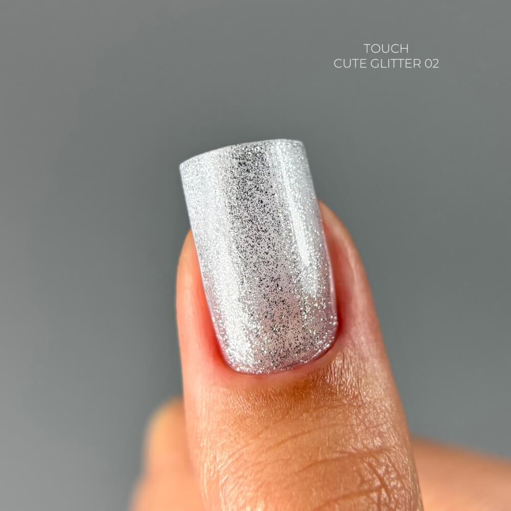 TOUCH Cute Glitter 2 — swatch on nail tip, dark silver sparkle finish