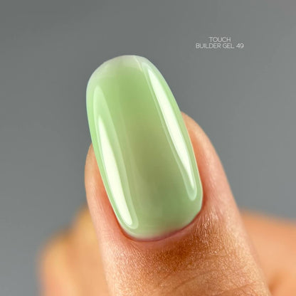 TOUCH Builder Gel 49 — swatch on nail tip, light green finish