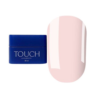Natural-looking sculpted nails in a delicate pink shade