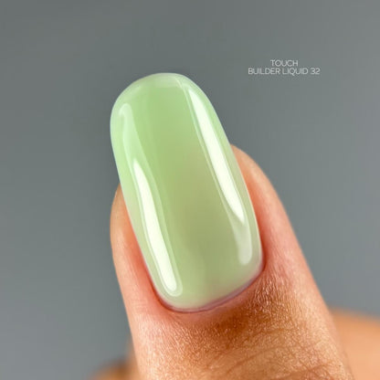 TOUCH Builder Liquid 32 — swatch on nail tip, light green finish