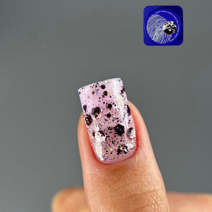 TOUCH Glow Gel 4 — swatch on nail tip, violet holographic shimmer