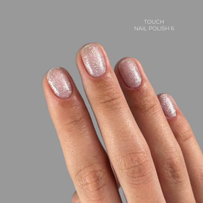 TOUCH Nail Polish 06 — swatch on nail tip, sheer silver shimmer finish