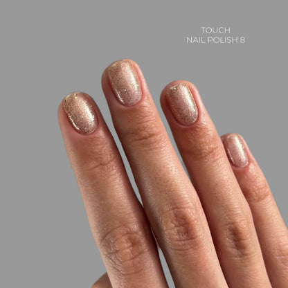 TOUCH Nail Polish 08 — swatch on nail tip, sheer gold shimmer finish